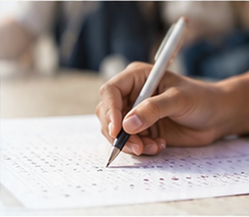 Student marking answers on an OMR sheet
